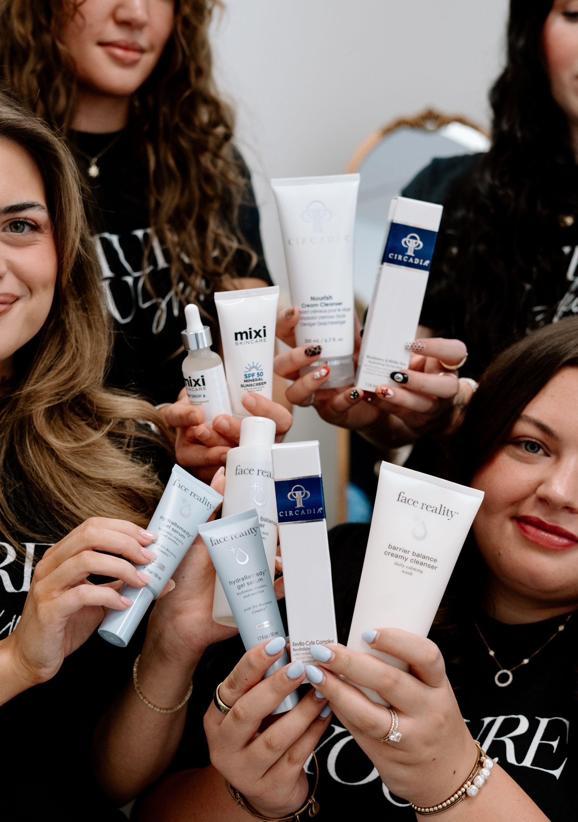 Professional esthetician consulting with a client about skincare routine and products in skin clinic