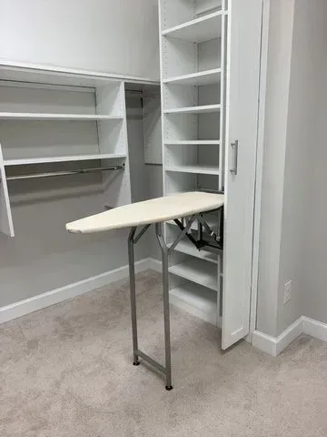 This closet features a fold-out ironing board that tucks away when not in use.