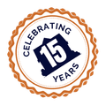 Celebrating 15 Years badge, featuring a blue shape of a building with