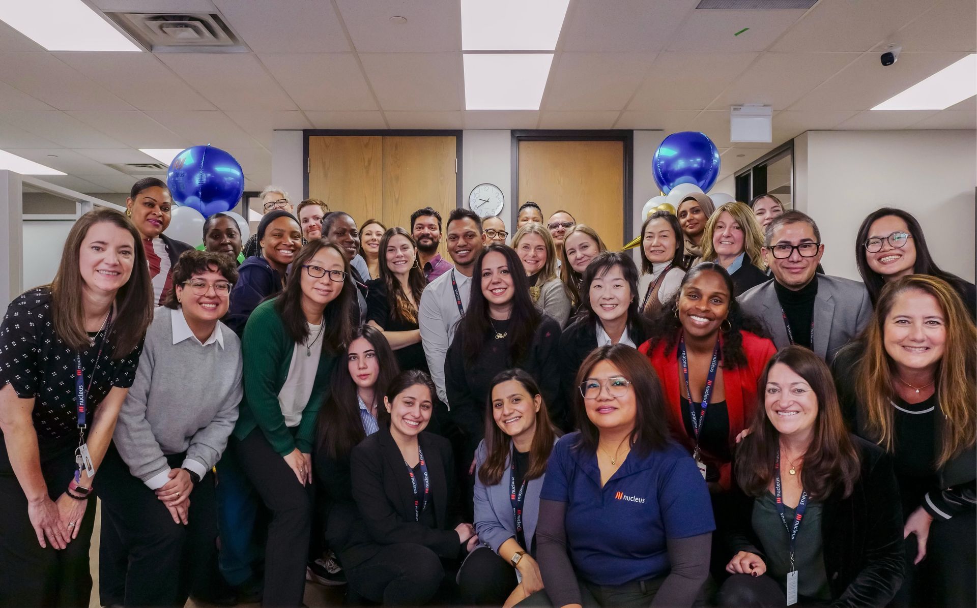 A group of women are sitting at a picnic table in a park.