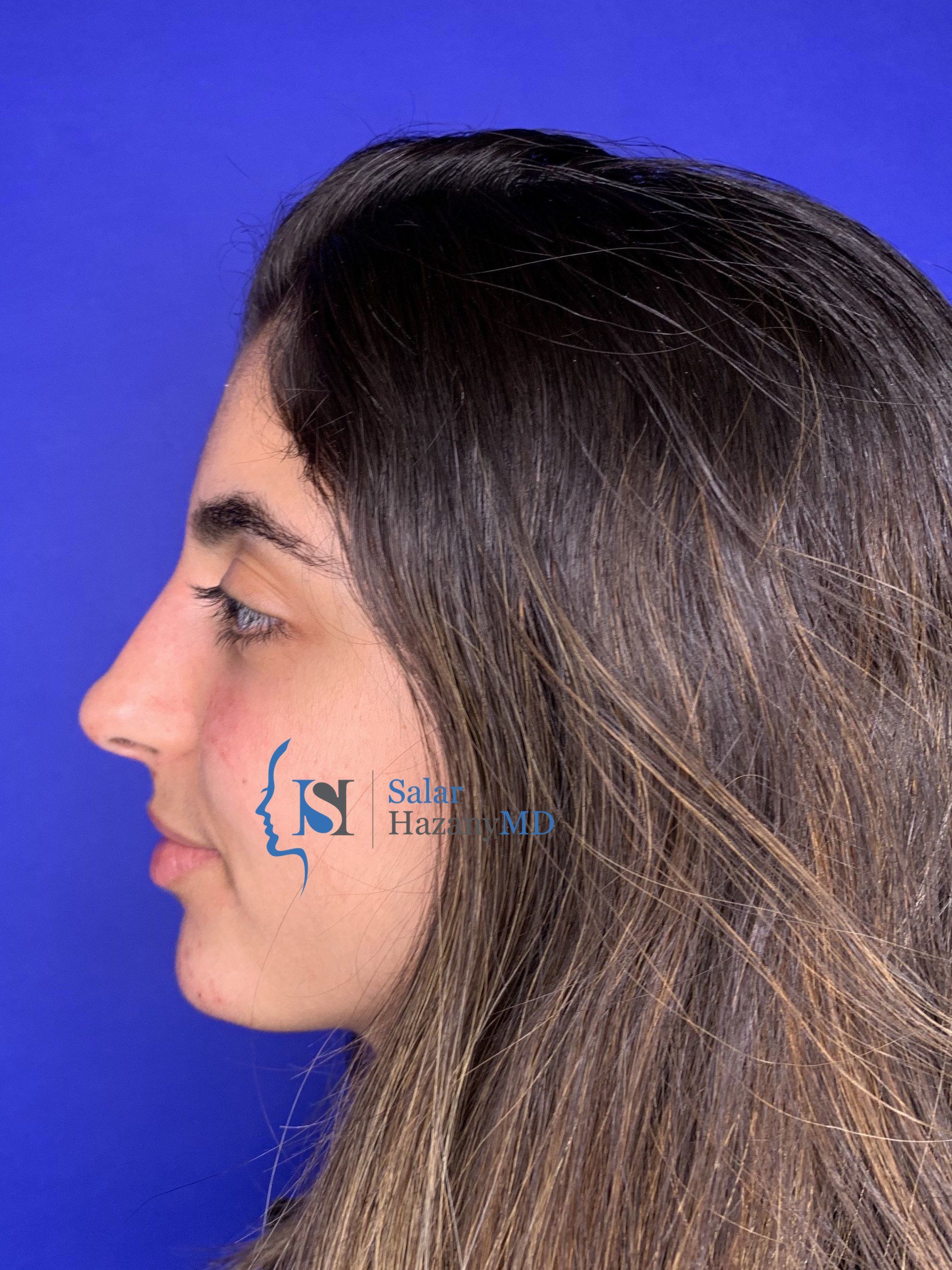 A close up of a woman 's face with the letter s on her face