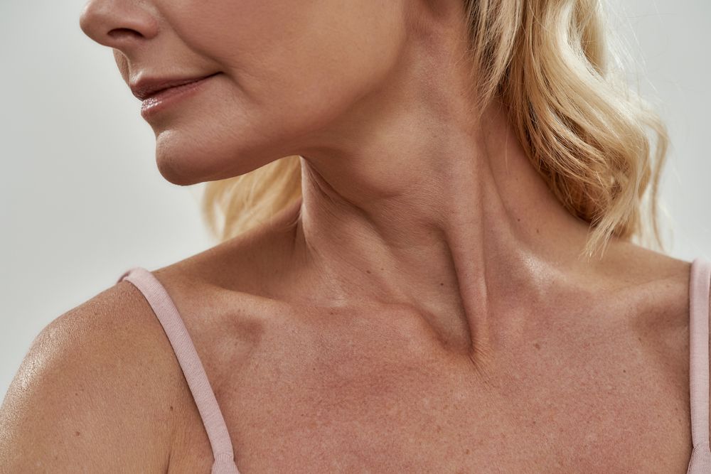A close up of a woman 's neck and chest.