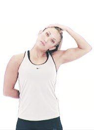 A woman is stretching her neck with her hand.