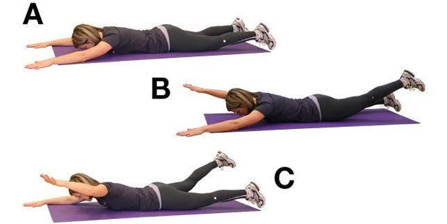 A woman is laying on a purple mat doing exercises.
