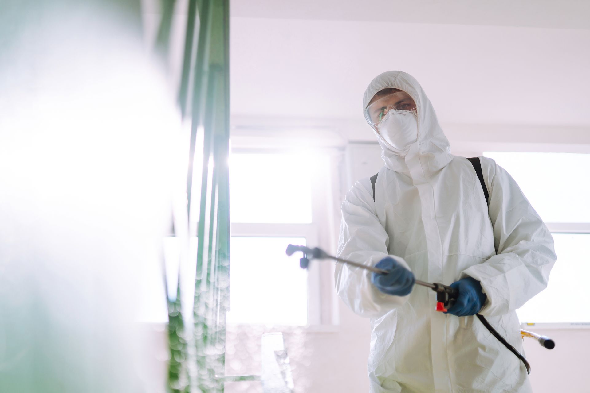 worker doing commercial pest control