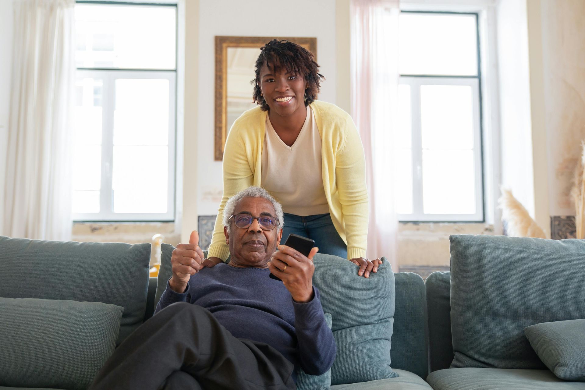 A man and a woman are sitting on the floor of a track.