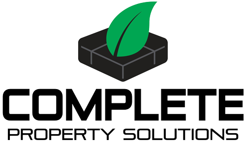 The complete property solutions logo has a green leaf on it.