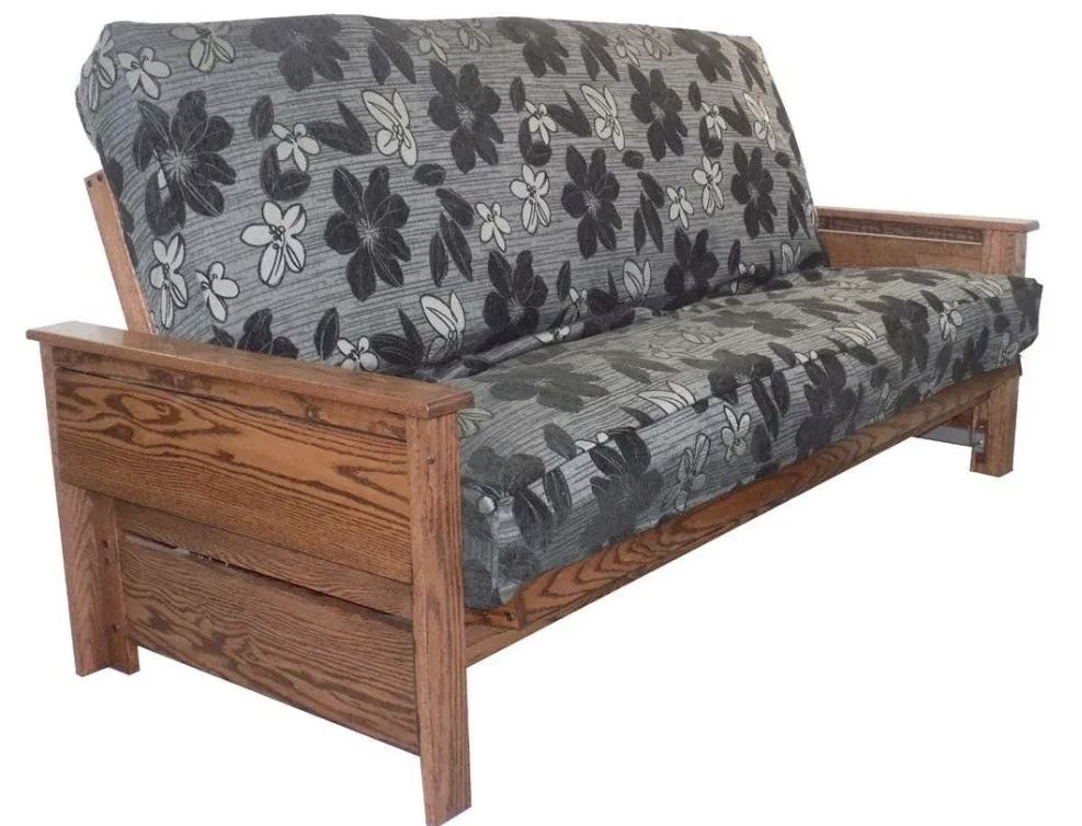 dark grey futon with floral pattern and wood frame