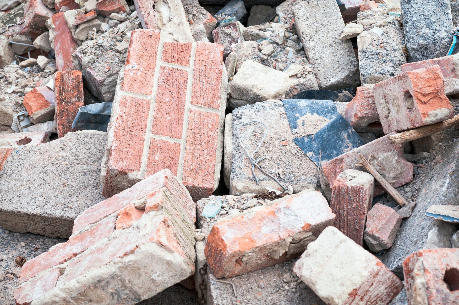 A Pile of Bricks and Rocks on The Ground | Caboolture, QLD | Dumpit Handy Bins
