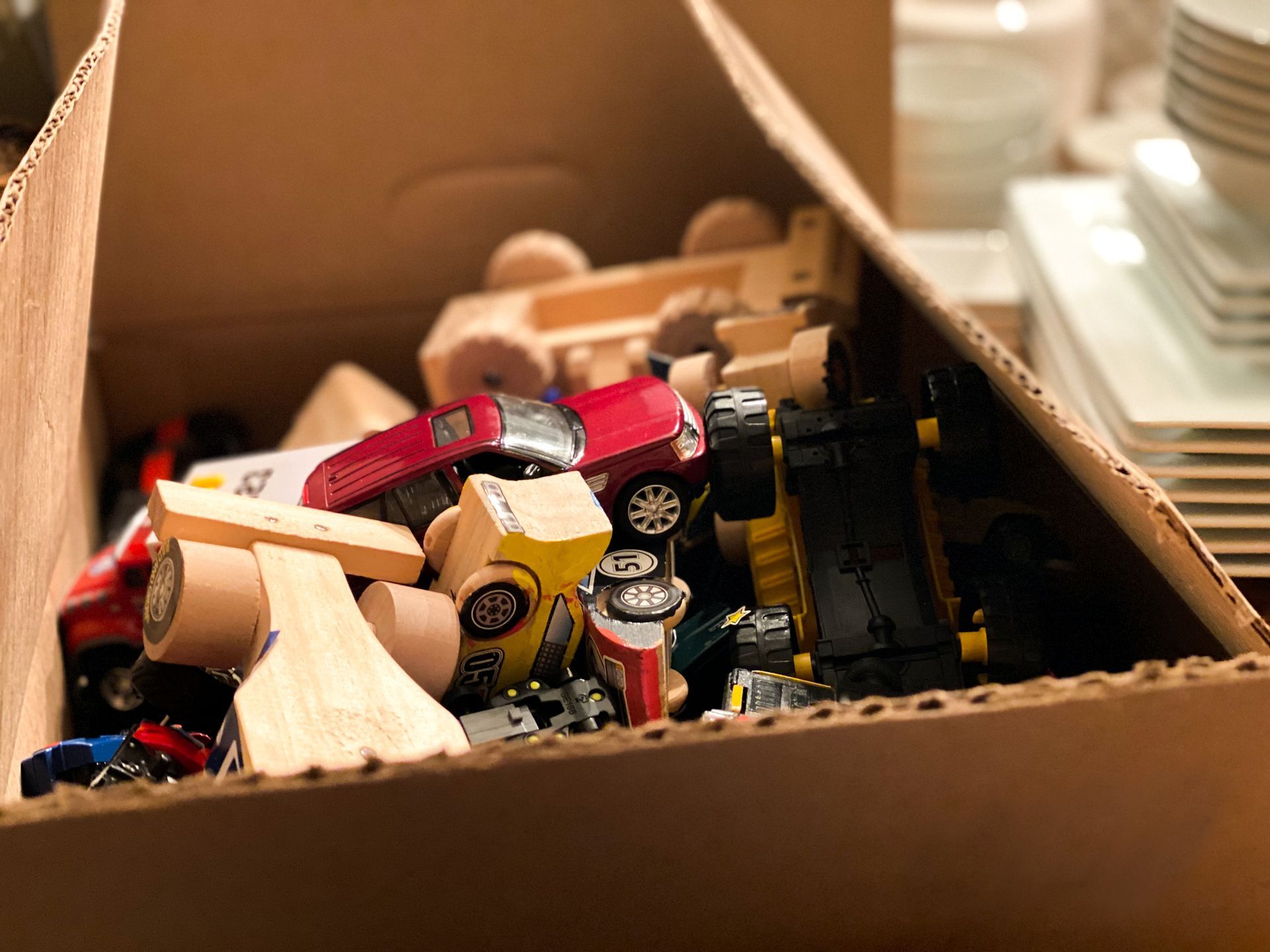 A Cardboard Box Filled with Toy Cars and Trucks | Caboolture, QLD | Dumpit Handy Bins