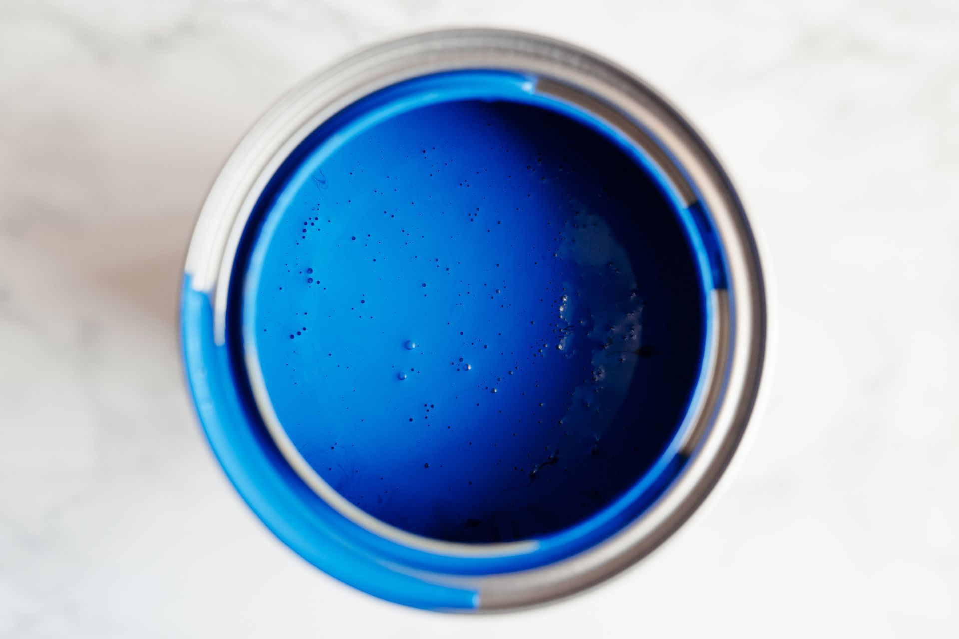 A Can of Blue Paint Is Sitting on A Table | Caboolture, QLD | Dumpit Handy Bins