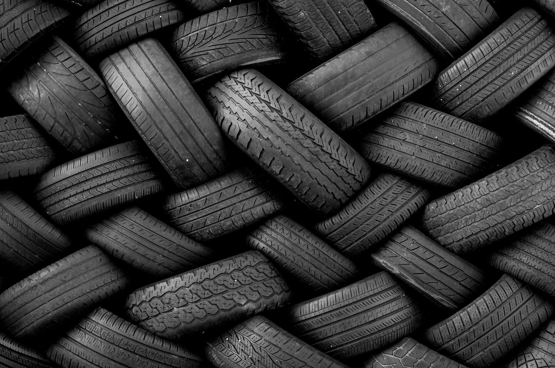 A Bunch of Tires Are Stacked on Top of Each Other in A Pattern | Caboolture, QLD | Dumpit Handy Bins