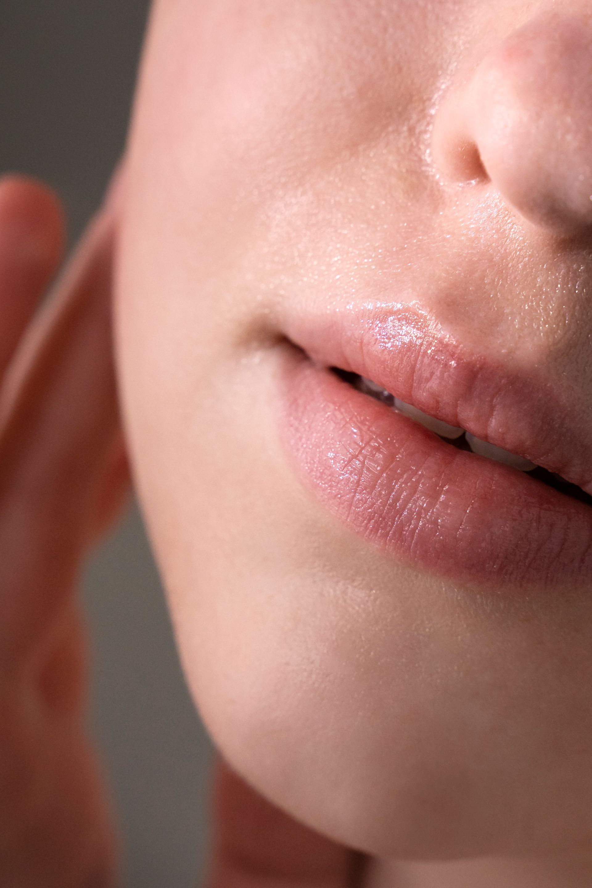 A close up of a woman 's lips and nose.