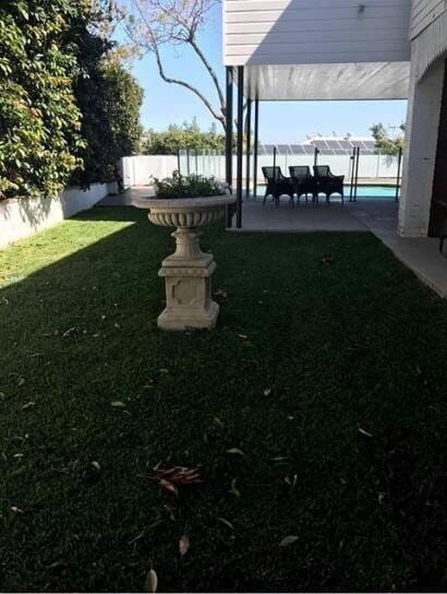 A Lawn With A Statue In The Middle Of It — Barron River Lawns In Biboohra, QLD