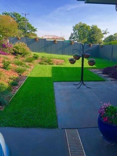 A Backyard With A Lush Green Lawn — Barron River Lawns In Biboohra, QLD