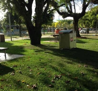 A Man Sits At A Picnic Table In A Park — Barron River Lawns In Biboohra, QLD