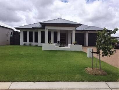 A Large House With A Lush Green Lawn In Front Of It — Barron River Lawns In Biboohra, QLD