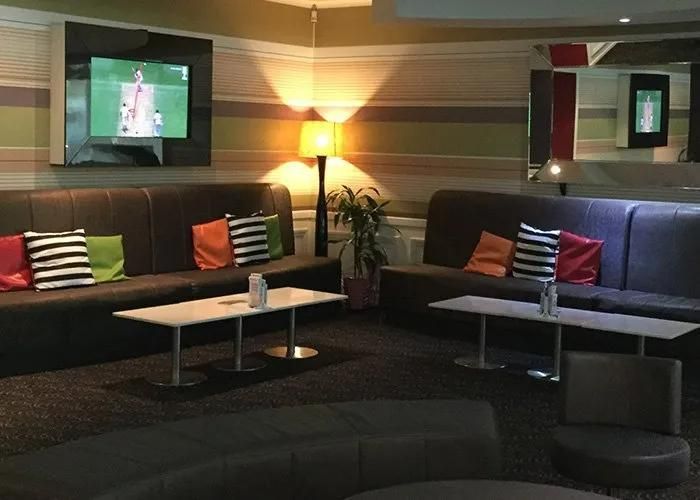 A Living Room With a Lot of Couches and Tables — Capricorn Tavern in Taranganba, QLD