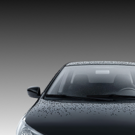 Black car's front with windshield covered in water droplets against a gray gradient background | Exclusive Collision And Customs