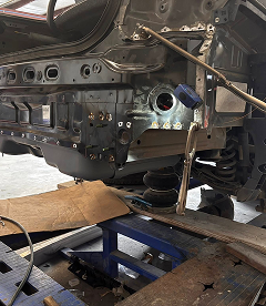 A Technician Welds a Vehicle Coupe in Houston, TX | Exclusive Collision And Customs