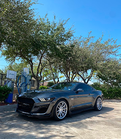 Ford Mustand Parked Next to Our Collision Center in Houston, TX | Exclusive Collision And Customs