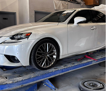 White Lexus in Our Garage in Houston, TX | Exclusive Collision And Customs
