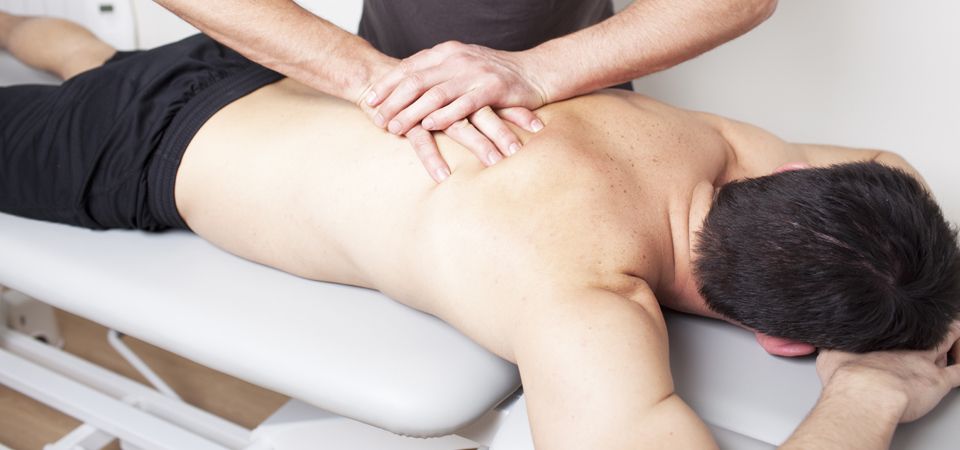 A male patient having a back treatment