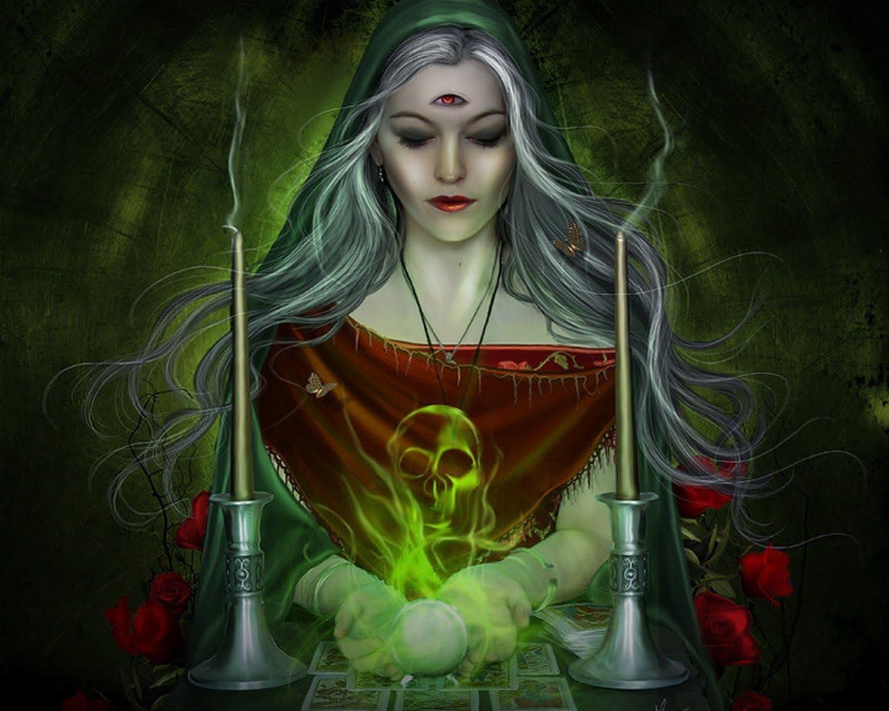a woman in a green robe is holding a skull and candles performing magic.