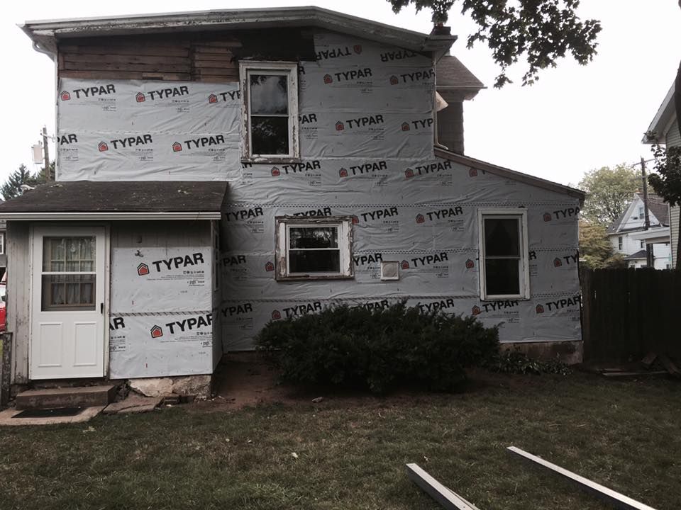 A house with styrofoam on the side of it