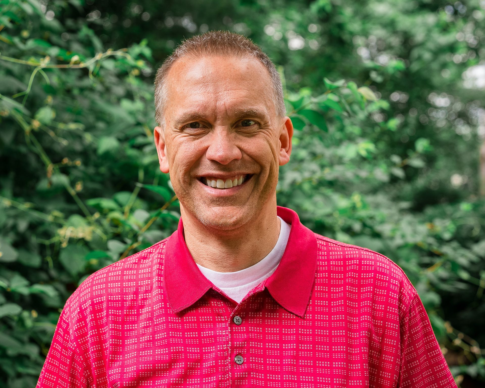 A silhouette of a man 's head on a gray background.