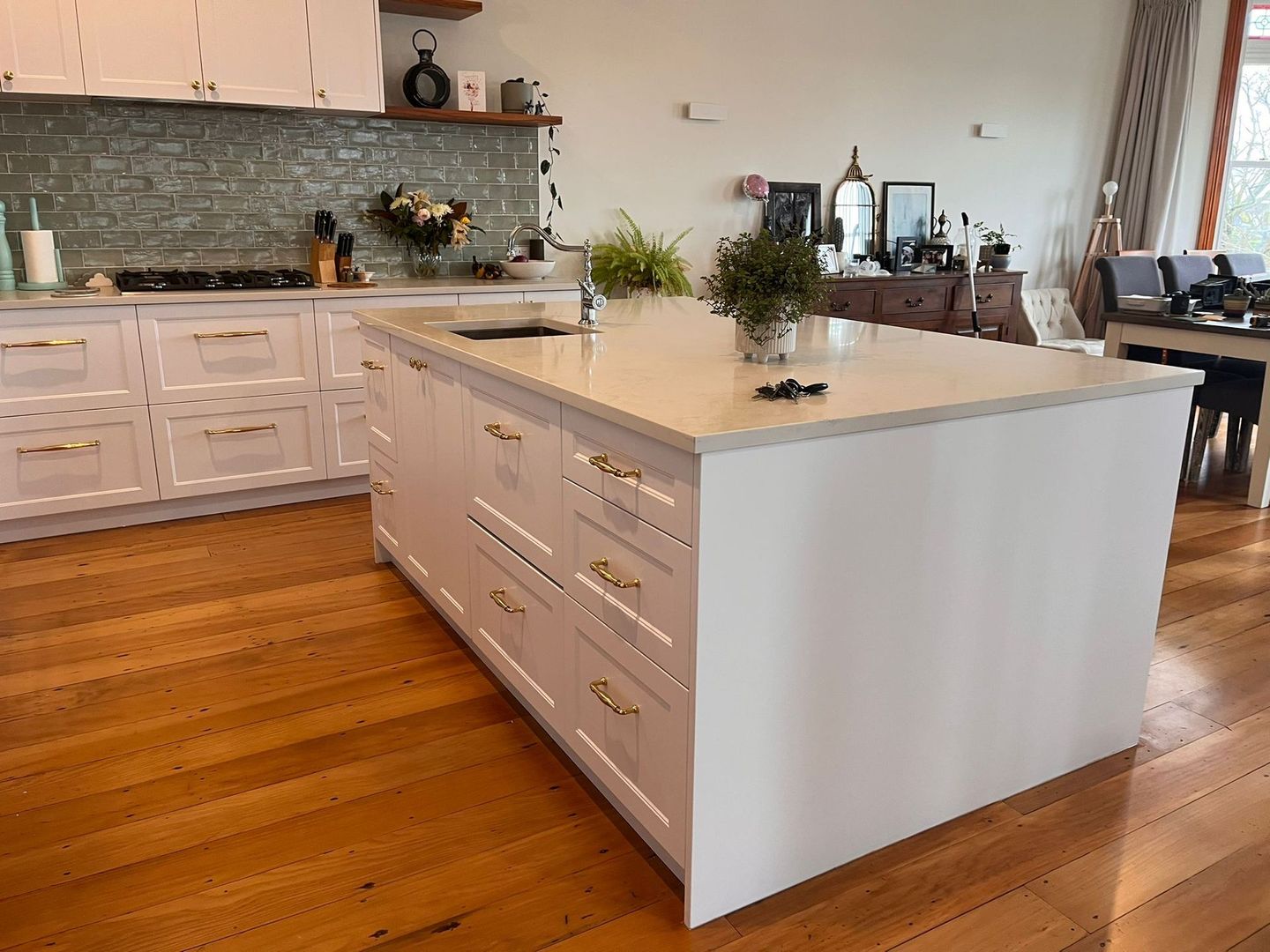 There is a large island in the middle of the kitchen.