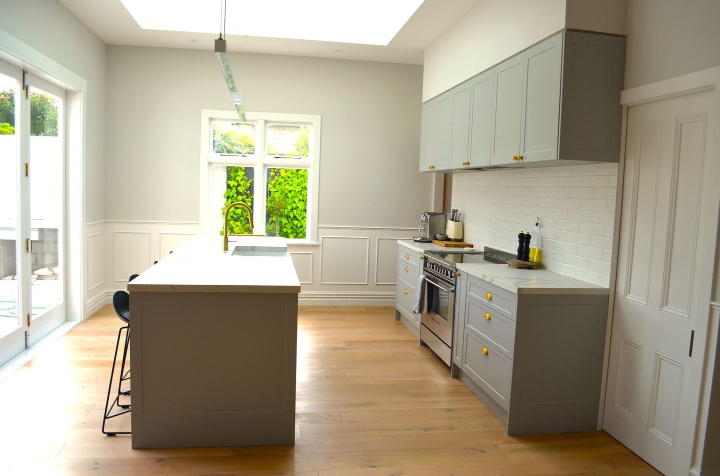 There is a large island in the middle of the kitchen.