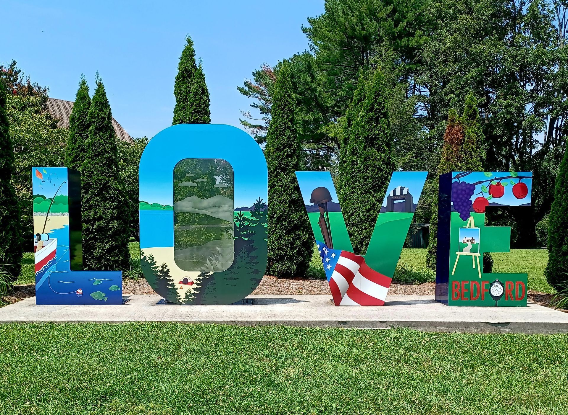 People enjoying a meal outdoors. Man grilling food, woman holding a glass. Sunlight illuminates the scene.