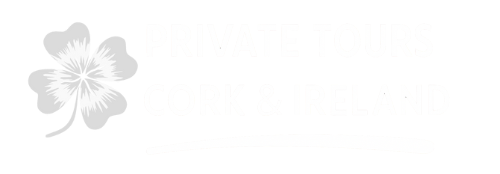 Logo featuring a four-leaf clover and text to its right, all in white.