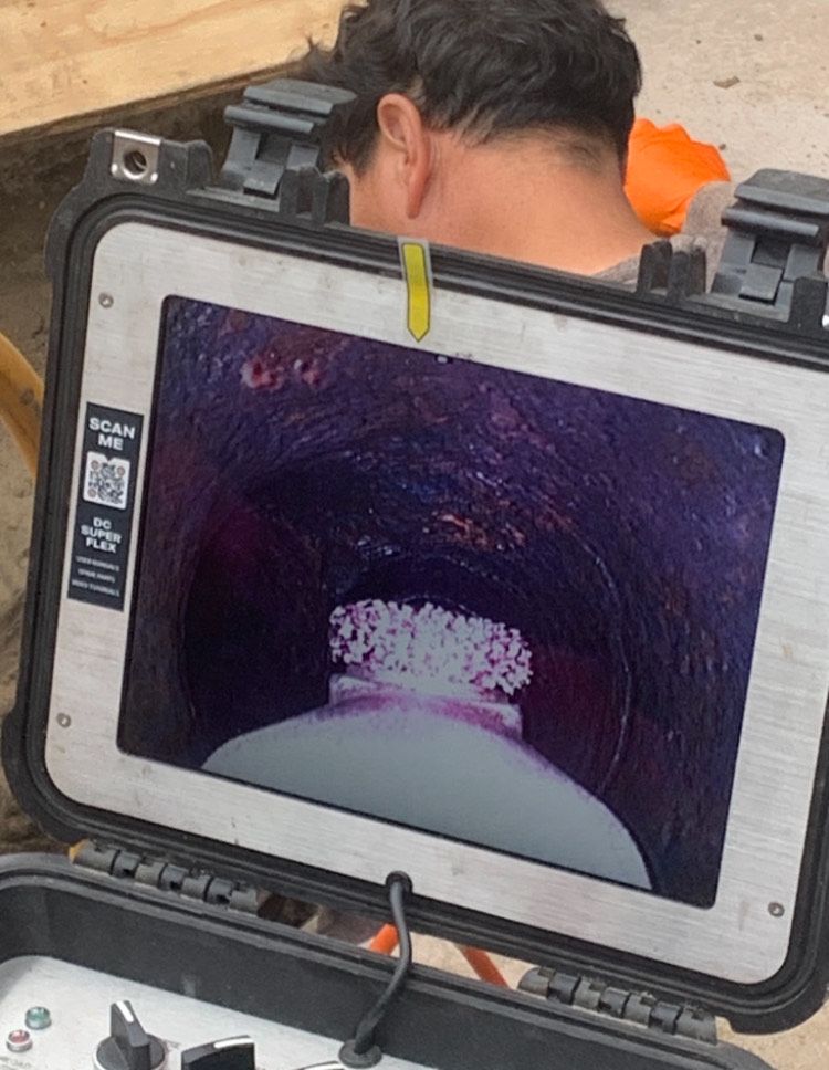 A man is looking through a tunnel on a tablet