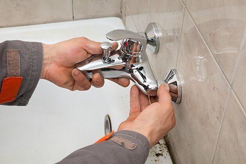 Plumber Repairing the Faucet — Columbus, OH — Accurate Plumbing