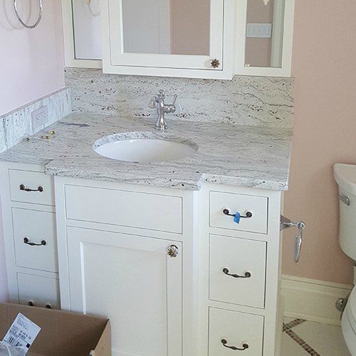 Faucet with Cabinets Below — Columbus, OH — Accurate Plumbing