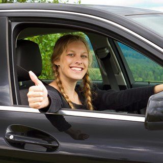 A girl giving a thumbs up