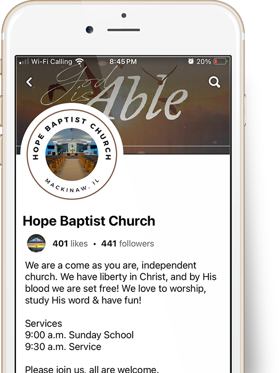 A phone with a facebook page open on it.