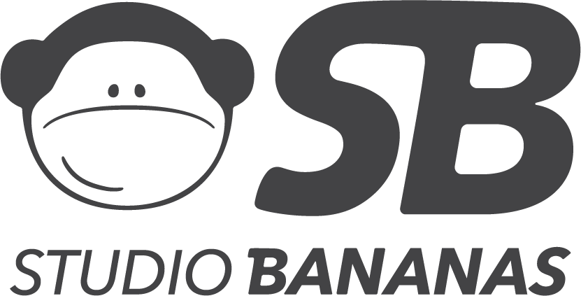 A black and white logo for studio bananas with a monkey on it