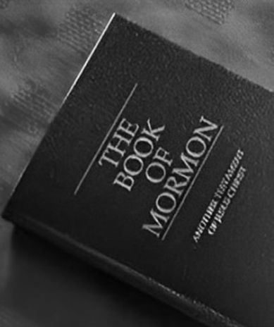 A black and white photo of the book of mormon
