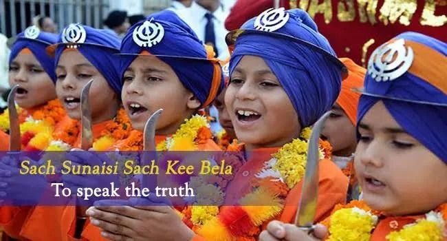 A group of children wearing turbans and holding swords are singing a song called sach sunaisi sach kee bela