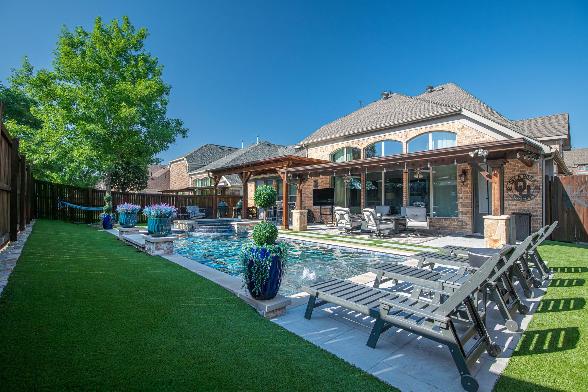 A fire pit is being built in the middle of a patio.