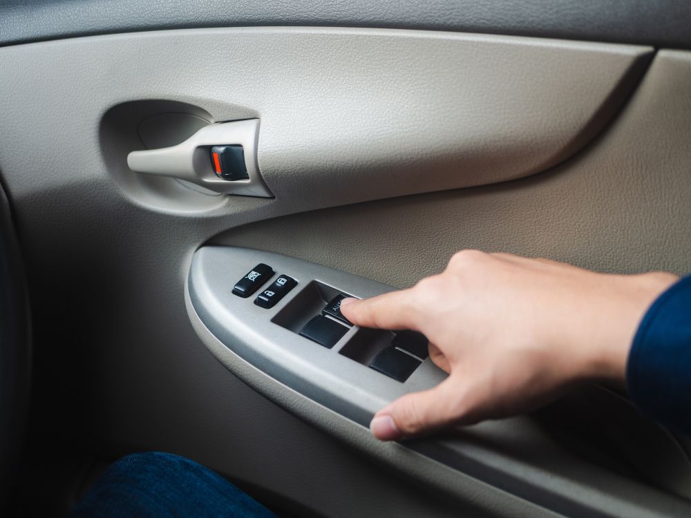 Pressing Car Window Control Button — Saint Joseph, MO — Render Auto Glass Inc.