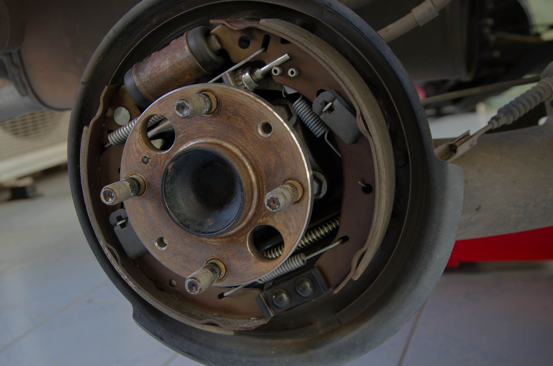 A close up of the rear brake on a car.