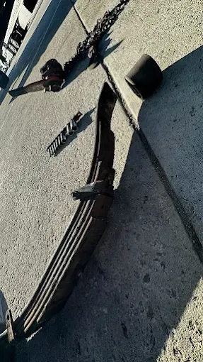 A close up of a piece of metal on a concrete surface.