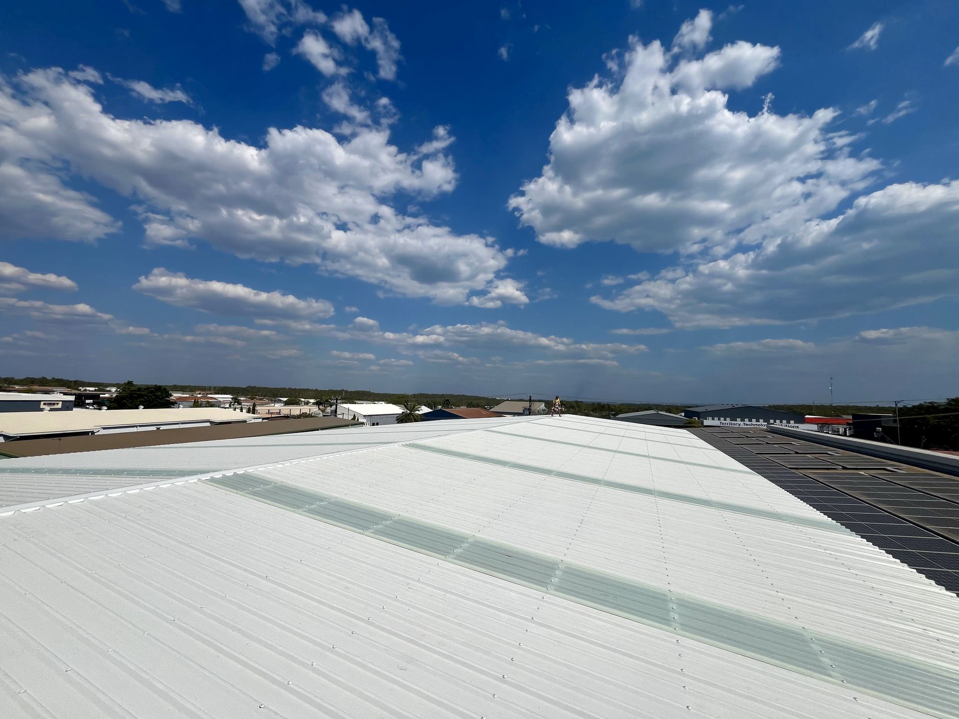 Large white roof in remote area with sky in the background