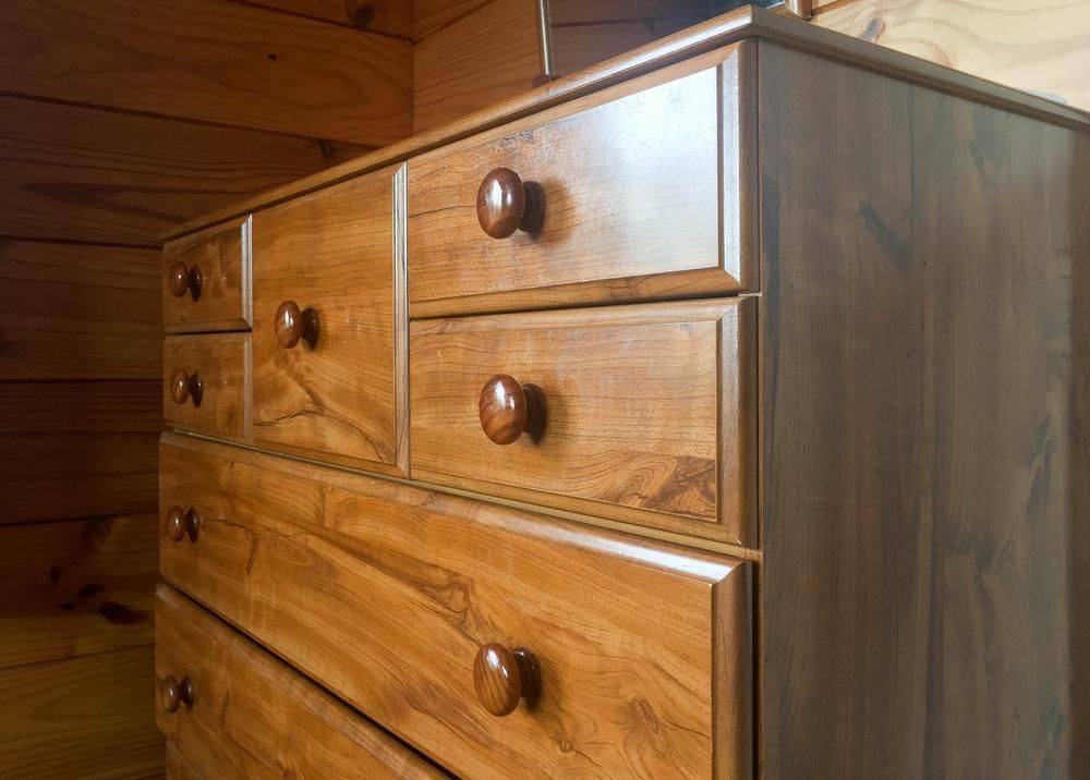 A Close up Of a Wooden Dresser with Drawers in A Room — Smith's Joinery in Alstonville, NSW
