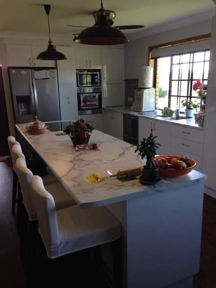 A Kitchen with A Marble Counter Top and White Cabinets — Smith's Joinery in Casino, NSW