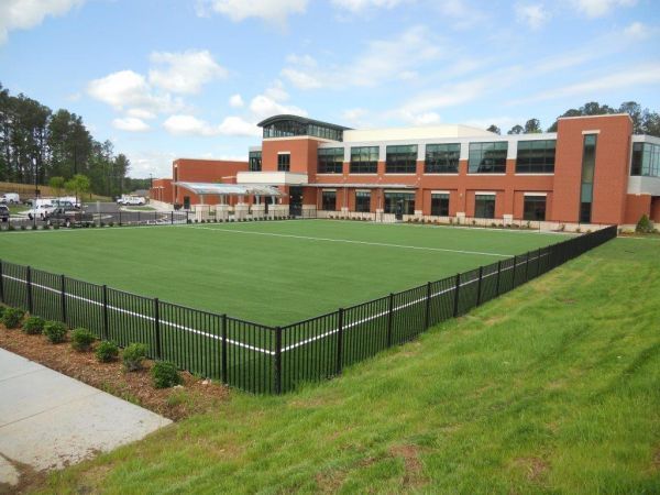 Green Lawn With Black Fence — Matthews, NC — Artificial Turf Products